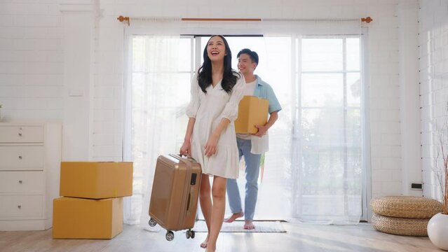 Asian young happy new marriage couple moving to new house together. 