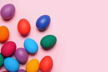 Colorful Easter eggs on pink background