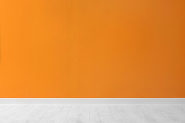 Beautiful orange wall and wooden floor in clean empty room