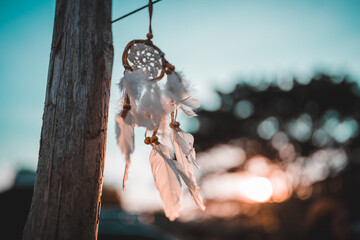 Close-up Of Dreamcatcher Against Cloudy Sky During Sunset, Dreamcatcher is a American native amulet on sunset. Shaman