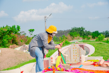 Chonburi, Thailand, 9, April, 2018: Chinese descendants cleaning tomb and offering prayers to...