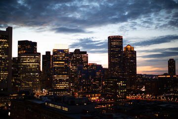 Boston city skyline at night sunsetting backlit buildings