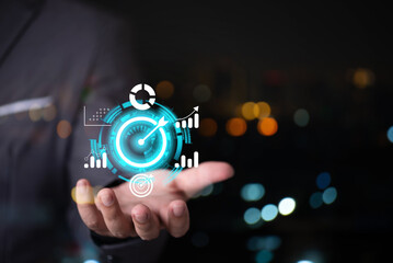 man hand holding virtual target business graph icon on screen , business target point