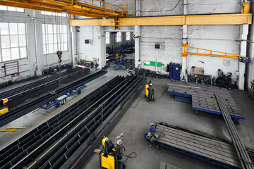 Long steel constructions assembling with welding in workshop