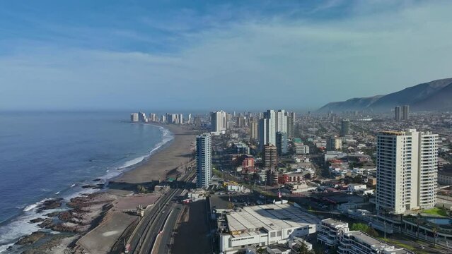 Hyperlapse shot of Iquique, Chile during the day with waves crashing on the beach