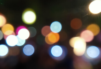 colorful bokeh lights background at night. blurry background and bokeh lights.  and new year celebration bokeh particle lights concept 