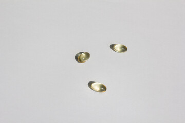 Transparent pills on a white background.