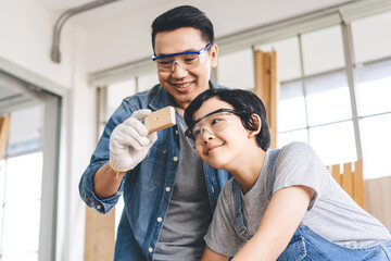 Fototapeta premium Southeast asian family father and son living together homeschooling