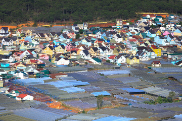  Landscape of houses on the mountain on a foggy day in the early morning at Da Lat, Vietnam