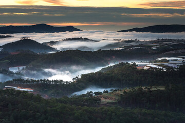 The magical beauty of the pine forests on the hill hidden in fog and cloud in the early morning at Da Lat town. Dalat is one of the most beautiful and the most famous traveling place in Viet Nam.