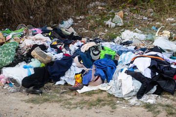 Illegal dump near country road. Junk pollution in nature.