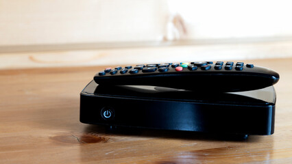 TV set-top box on a wooden background