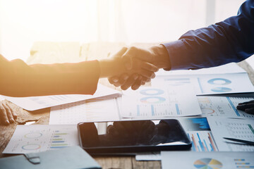 Business handshake for teamwork of business merger and acquisition,successful negotiate,hand shake,two businessman shake hand with partner to celebration partnership and business deal concept - obrazy, fototapety, plakaty
