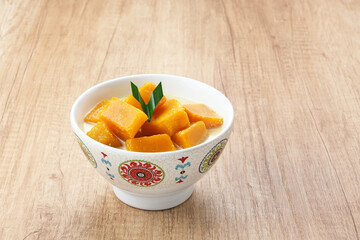 Kolak Waluh or Kolak Labu Kuning, Indonesian traditional food. Pumpkin in sweet coconut milk. Popular during ramadan
