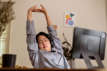 asian woman stretching when working long time at home