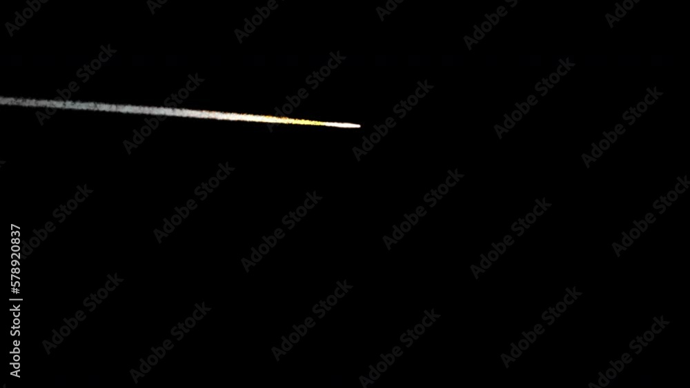 Wall mural a small-sized meteor flying across the sky at a distance. the shot is 4k and comes with and without 