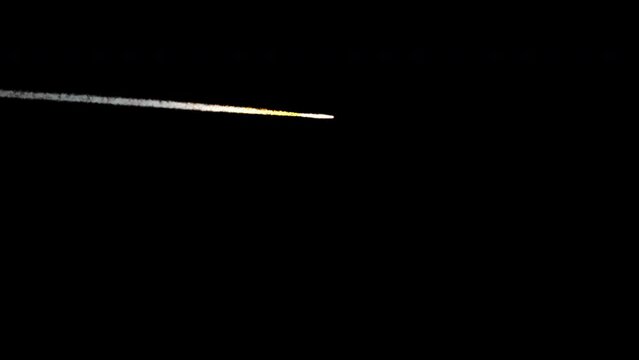 A small-sized meteor flying across the sky at a distance. The shot is 4K and comes with and without an alpha channel