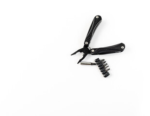 Obraz premium Multi purpose tool with screwdriver bites on white isolated background