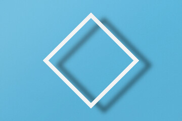 paper cut into square shapes with light and shadow Placed on a light blue paper background.