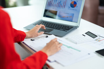 Woman working at home office hands on keyboard close-up