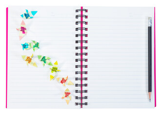 closeup open note book with pencil  isolated