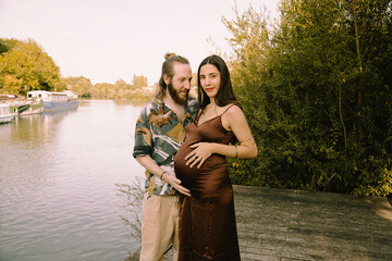 future parents couple family photoshoot by the river