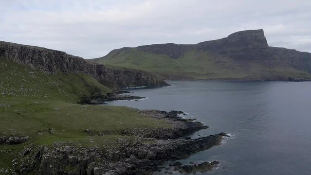 4k aerial drone footage along rocky coastline at neist point in scotland uk