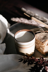 morning coffee latte with bread in the warm light of the window