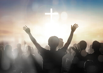 Silhouette human raising hands to praying God on blurred cross  background - obrazy, fototapety, plakaty