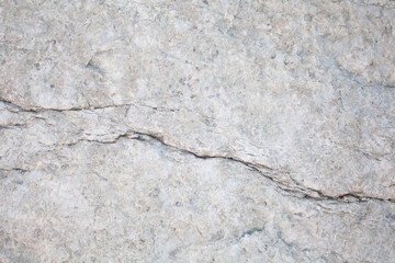 White stone surface, background, pattern with cracks