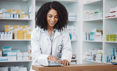 Pharmacy, medical and pharmacist typing on a tablet searching medicine online, internet and web in...