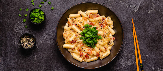 Spicy Rice Cake with Cheese and Bacon or Cream Teokbokki, Tteokbokki.