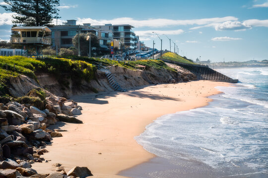 North Cronulla Beach in Sydney almost vanishes after a severe storm. The waves reached the sea wall and huge sand was ripped from the beach due to coastal erosion in June 2022, NSW, Australia.