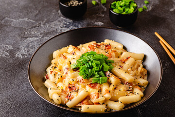 Spicy Rice Cake with Cheese and Bacon or Cream Teokbokki, Tteokbokki.