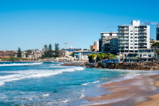Coastal erosion at North Cronulla Beach in Sydney, NSW, Australia. A huge amount of sand was ripped from the beach and the ocean reached close up to the sea wall and nearby buildings in June 2022.