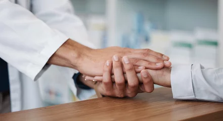 Foto op Plexiglas Empathy, support and pharmacy with hand holding with people for consulting, rehabilitation and results. Kindness, medical and healthcare with expert and patient for healing, help and sympathy © Anela R/peopleimages.com