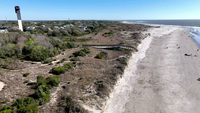 sullivan's island lighthouse fast aerial pullout over beach near charleston sc, south carolina