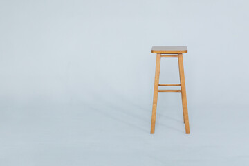 Bar stool with is an empty white room on a white background.