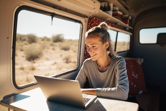 Digital Nomad Woman Using Laptop Inside Her Camper Van, Happy Developing Her Passion on a Sunny Day. Concept of Digital Nomads and Entrepreneurial Women