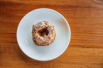 Top view of French pastry Paris Brest on a white plate