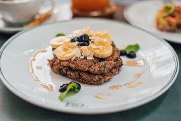 Healthy Breakfast Pancake oatmeal topped with bananas