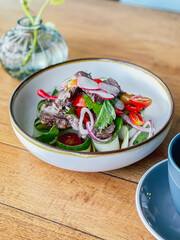 Thai Beef Salad on a wooden table