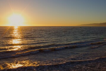 Sun setting over the ocean.