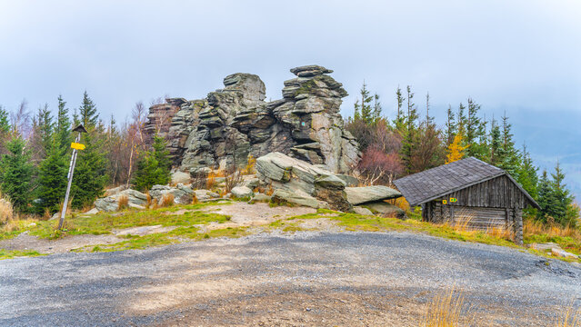 The rock formation of Giant Rocks, Czech: Obri skaly, beneath Mount Serak on a cloudy day. Hruby Jesenik, Czech Republic