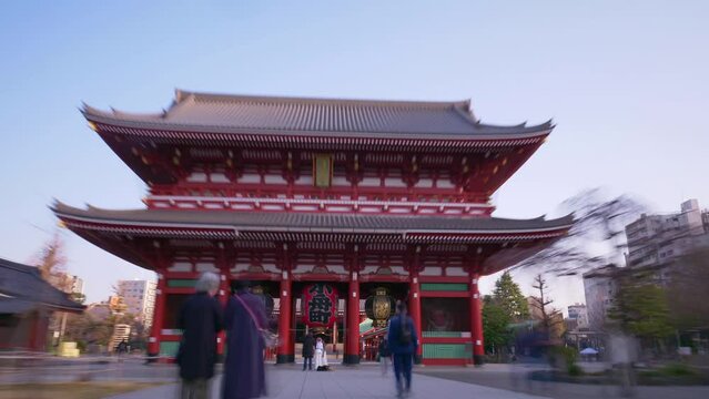 Senso-ji temple Buddhist pagoda in Asakusa, Tokyo, hyper lapse of famous Japanese shrine, gimbal shot of walking through Japanese shrine gate. High quality 4k footage