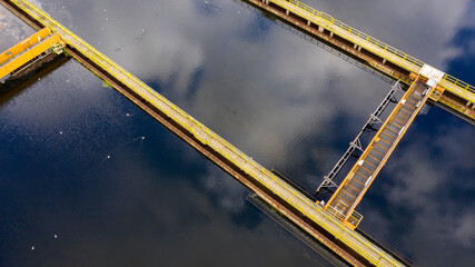 Aerial view of rectangular tanks of a sewage and water treatment plant enabling the discharge and...