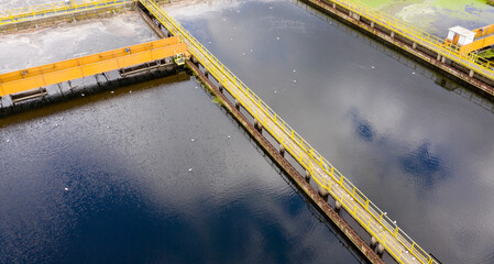 Aerial view of rectangular tanks of a sewage and water treatment plant enabling the discharge and...