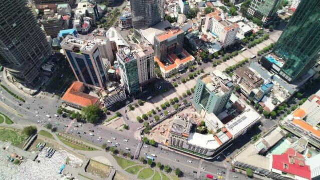 aerial top down of traffic driving through District 1 in Ho Chi Minh City Vietnam on a sunny day