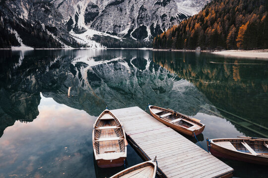 Wooden boats at the alpine mountain lake. Lago di Braies