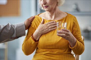 Cropped portrait of emotional senior woman sharing her story in mental health support group